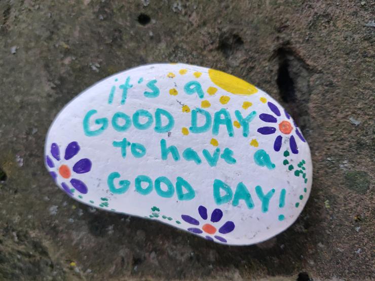 Painted rock that says "it's a good day to have a good day!"