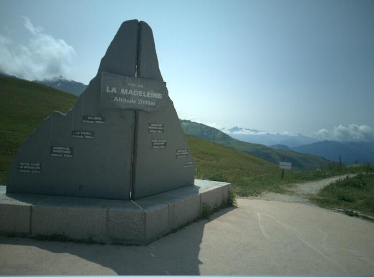 profile of the two roads leading up to col de la madeleine as a stone monument